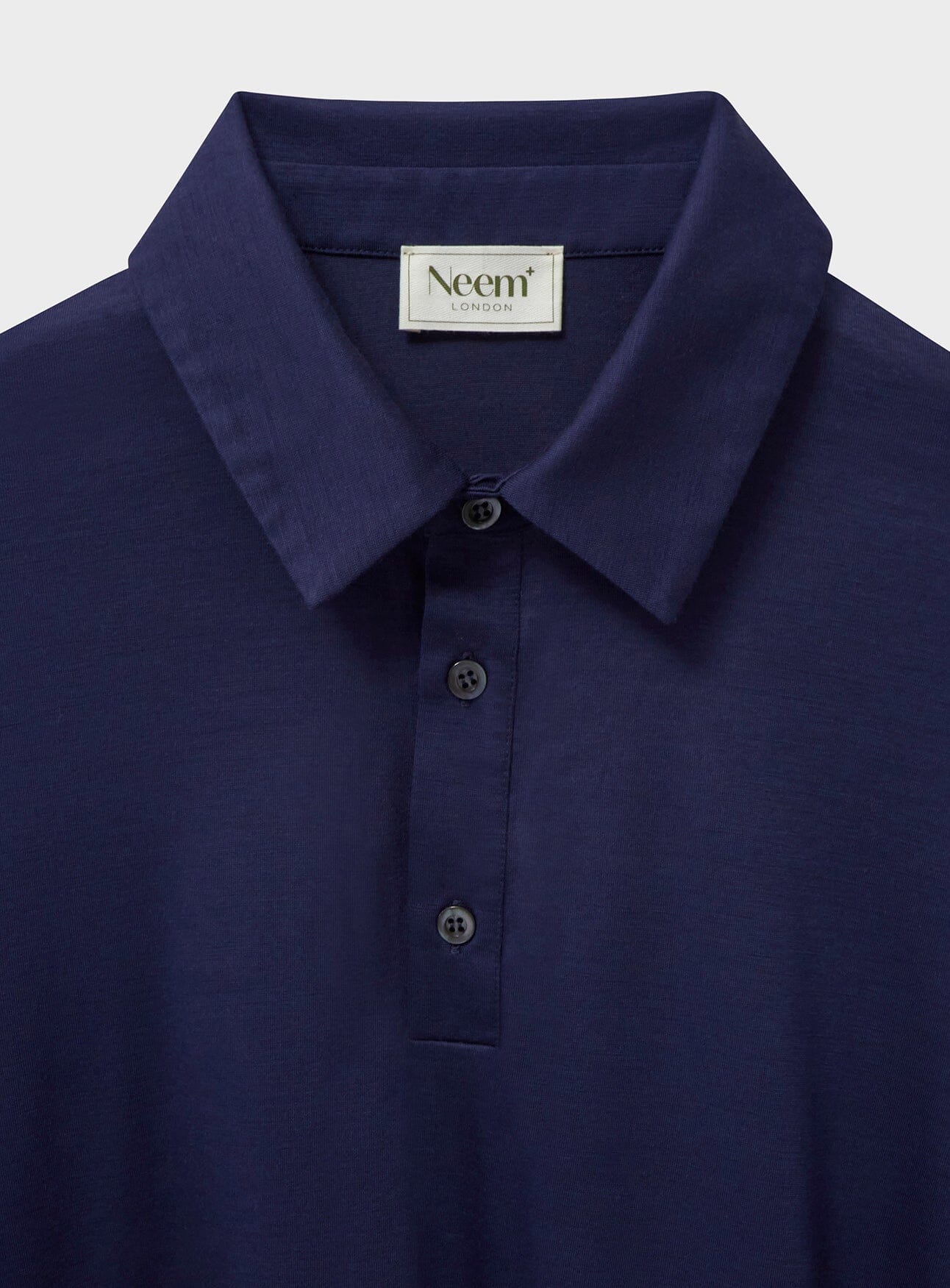 Polo extensible en laine mérinos bleu acier